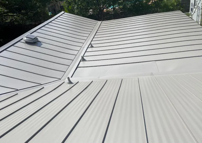 Solar attic fan installed on a metal roof for Roof Ventilation in Orange Beach